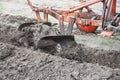 Ploughing with old-time plough with two plow blades Royalty Free Stock Photo