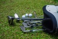 Closeup old golf bags on green. Set of golf clubs over green field background Royalty Free Stock Photo