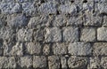 Closeup of an old grey  stone wall Royalty Free Stock Photo