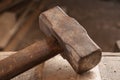 Closeup of an old hammer on wood table Royalty Free Stock Photo