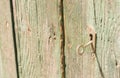 Keyhole with key of old wooden front door, close-up Royalty Free Stock Photo