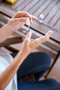 Closeup of an old lady painting her nails Royalty Free Stock Photo