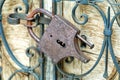 Old Large Rustic Padlock On The Wooden Door