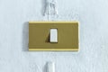 A closeup in a old light switch on the old wall. Royalty Free Stock Photo