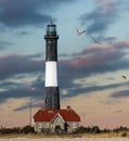 Large puffy clouds getting lit up with sunset colors. Fire Island National Seashore - Long Island New York Royalty Free Stock Photo