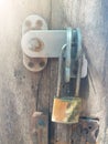 Closeup of old lock the door. Rusty lock on an old wooden vintage gate Royalty Free Stock Photo