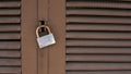 Closeup of old lock on red metal door. Old iron lock on the door. Royalty Free Stock Photo