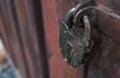 Closeup of old lock on red metal door. Old iron lock on the door. Royalty Free Stock Photo