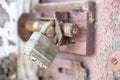 Closeup of old lock on red metal garage door Royalty Free Stock Photo