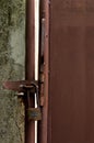 Closeup of old lock on the steel door of factory. Royalty Free Stock Photo