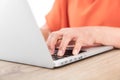 Closeup old man`s hands typing enter on laptop keyboard Royalty Free Stock Photo