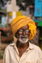Closeup of old man with saffron turban  Nandakeshwar  Karnataka  India Royalty Free Stock Photo
