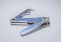 Closeup on an old nail cutter on white surface Royalty Free Stock Photo