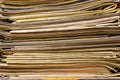 Closeup of old newspapers and magazines, stack, side view Royalty Free Stock Photo