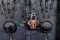 Closeup of an old padlock on an old ornate church door Royalty Free Stock Photo