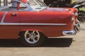 Closeup of the old red Chevrolet car back on a street