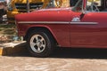 Closeup of the old red Chevrolet car front on a street