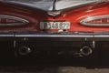 Closeup of an old red Chevrolet car and its numbers