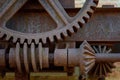 Closeup of old rusted steel gears outside at historic factory Royalty Free Stock Photo