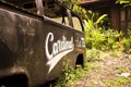 Closeup of an old rusty Cardinal jeep on the side of the road in Jakarta