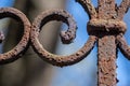 Closeup old rusty metal fence. Fragment of the pattern of the fence