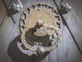 Old rusty door knocker on door