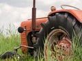 Closeup of old rusty traktor in field Royalty Free Stock Photo