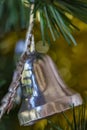 Closeup of old silver Christmas ornament on tree. Royalty Free Stock Photo