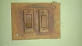 Closeup of old switch board on wall. Royalty Free Stock Photo