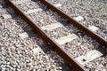 Closeup of an old train railway with wooden sleepers and stone floor Royalty Free Stock Photo