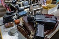 Closeup of an old vintage camera on a leather bag at a flea market in Paris, France