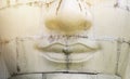 Closeup old white sculpture face with vintage warm light Royalty Free Stock Photo