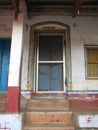 old window with terra-cotta tiled roof. An architectural details from Goa, India. Royalty Free Stock Photo