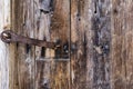 Closeup old wooden door with iron rusty lock. Vintage, Grunge. Royalty Free Stock Photo