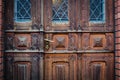 Closeup of old wooden door with metal handle Royalty Free Stock Photo