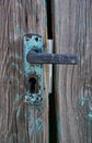 Closeup of old wooden door painted with cracks Royalty Free Stock Photo