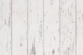 Closeup of old wooden vertical plank background. Aged white painted doors, fence. Weathered timber panels. Grunge Royalty Free Stock Photo