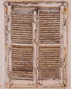 Closeup of an old, wooden window shutter with faded paint Royalty Free Stock Photo