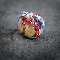 Closeup of Old Worn Ragged Baseball Torn Cover for Sport Royalty Free Stock Photo