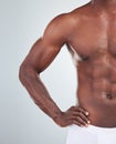 Closeup of one African American fitness model posing topless in a underwear and looking muscular. Confident black male Royalty Free Stock Photo