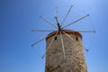 Closeup of One of the Ancient Windmills Against the Blue Sky on Rhodes Harbor Royalty Free Stock Photo