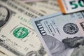 Closeup of one hundred dollar banknote next to one dollar and fifty euros Royalty Free Stock Photo
