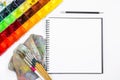 Closeup open note book with tray colors on background Royalty Free Stock Photo
