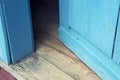 Closeup of open old blue wooden door Royalty Free Stock Photo