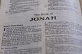 Closeup of an open page of the book of jonah with partly blurred text Royalty Free Stock Photo