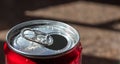 Closeup of open soda can with water drops on blurred background Royalty Free Stock Photo