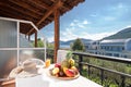 Closeup of open terrace balcony under oak wooden old roof of modern style hotel room apartment with summer garden, country houses Royalty Free Stock Photo