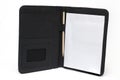 Closeup opened leather notepad notebook white background