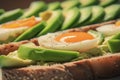 closeup of an openface sandwich with sliced avocado and egg