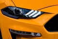 Closeup of an orange car's headlight. Royalty Free Stock Photo